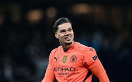 Ederson stands in front of Man City
