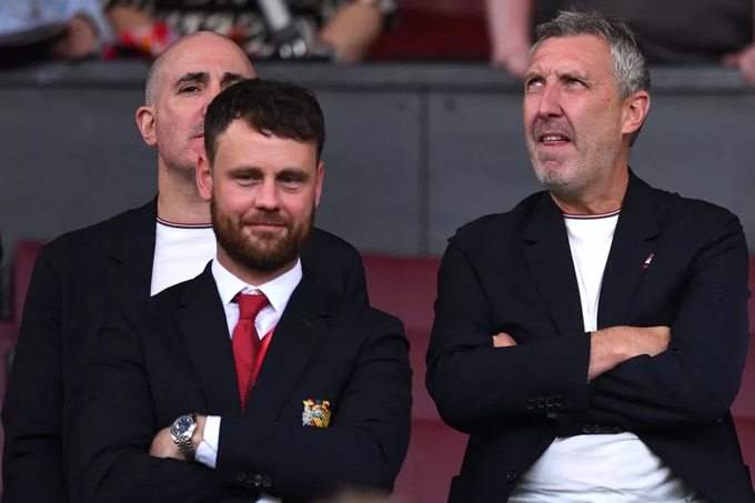 Berrada (behind), Vivell and Wilcox (right) in the area for the Board of Directors at Old Trafford